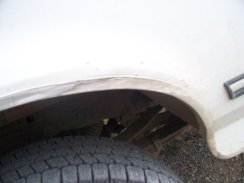 1992 Ford F-250 - Close-up of the rear wheel well and suspension components on a 1992 Ford F-250.