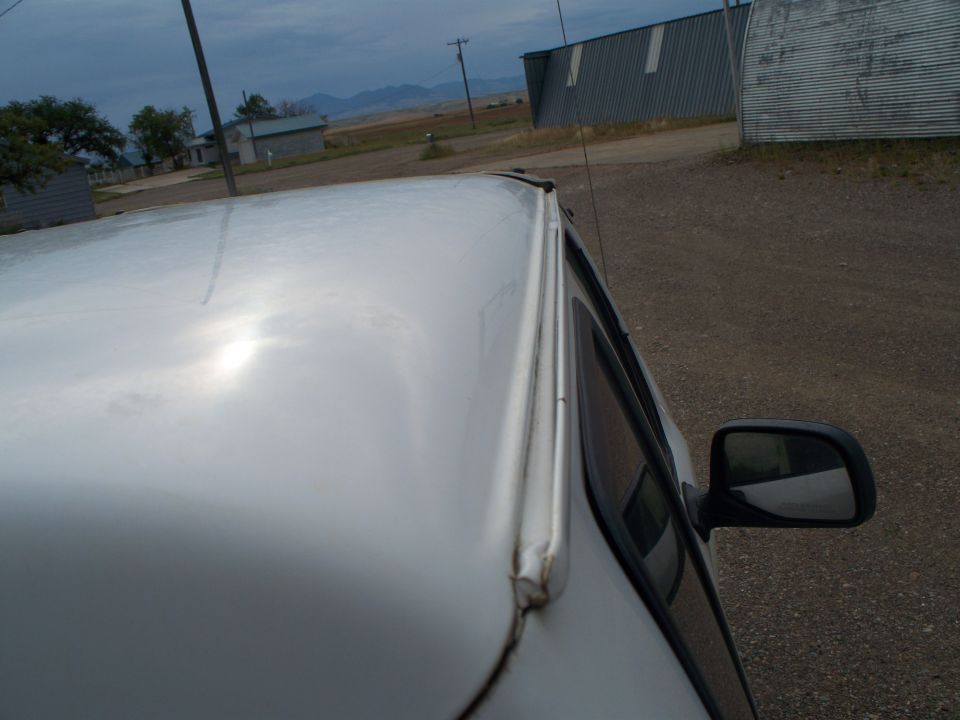 White truck roof and side mirror, side view