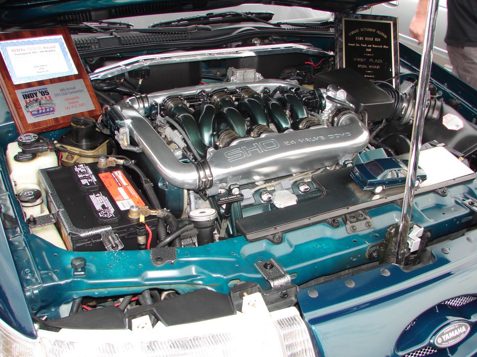Engine bay with SHO 24 Valve DOHC engine cover and two awards