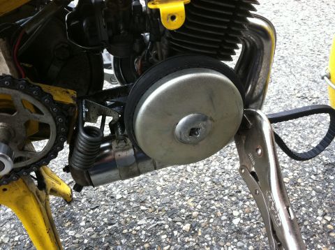 1981 Garelli Rally Sport - A vise grips a belt near a moped's engine and chain drive.