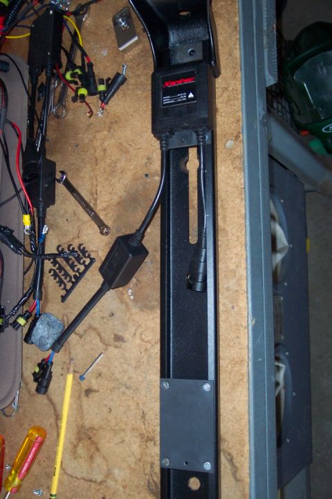 1995 Ford Bronco - Close-up of a black light bar wiring harness with a red "Apex" label and various connectors.