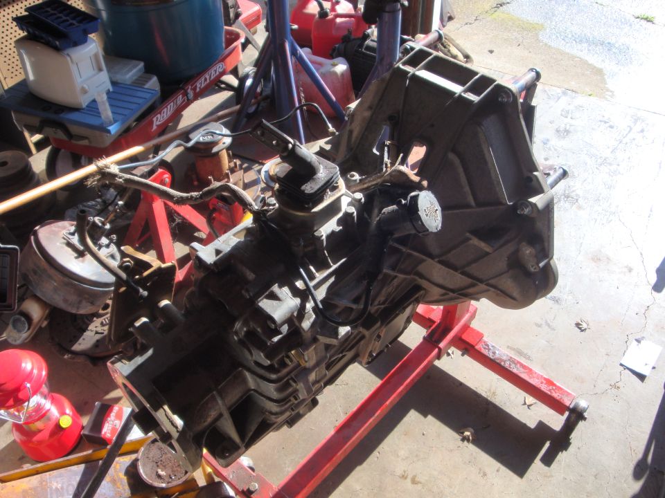 Transmission on red engine stand, viewed from the side
