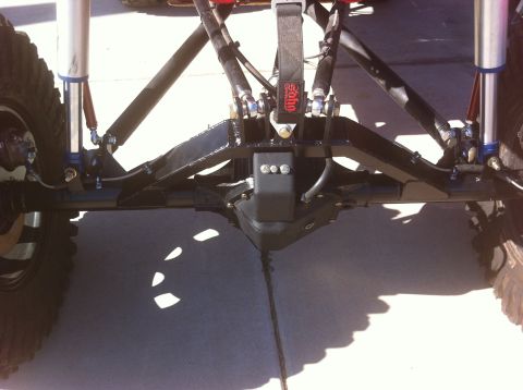 Suzuki Samurai - Close-up of a modified rear axle assembly, showing heavy-duty suspension components and shock absorbers.