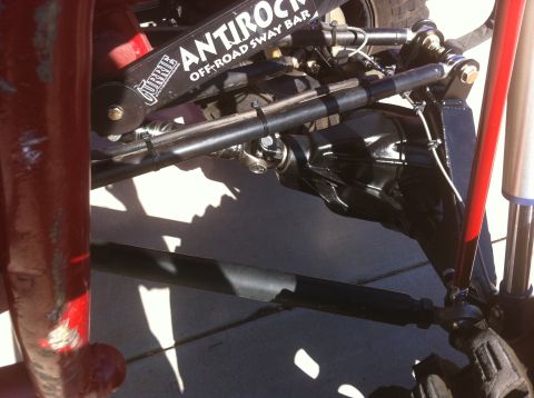 Suzuki Samurai - Close-up of off-road suspension and axle components, including a Currie sway bar.