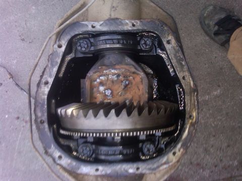 1988 Ford Bronco - Close-up view of a vehicle's differential, revealing the ring and pinion gears within the housing.