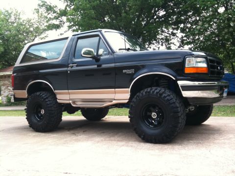 1996 Ford Bronco - This lifted 1996 Ford Bronco features a two-tone paint scheme and aggressive off-road tires.