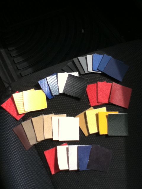 2006 Ford E350 - Various material swatches are displayed on a dark, textured surface, likely inside a vehicle.
