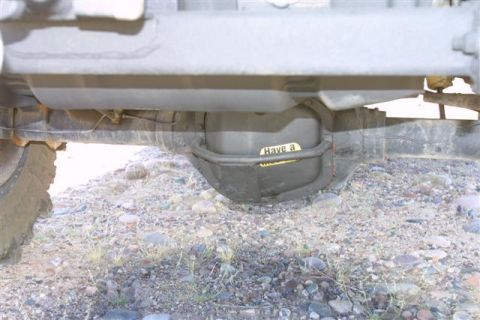 1994 Ford Bronco - A sticker with partial text is visible on the rear differential of an unidentified vehicle.