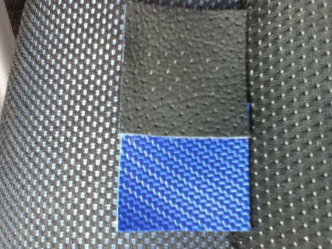 2006 Ford E350 - Close-up of different fabric materials, likely for automotive interior upholstery or trim.