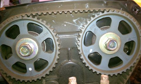 1999 Ford Expedition - The image shows two engine timing gears and a timing belt, indicating internal engine components.