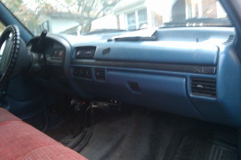 1996 Ford Bronco - Interior view of a truck's dashboard and passenger seat, the 'XL' trim designation.
