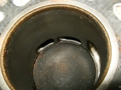 2000 Ford E350 - Close-up view of the inside of an engine cylinder, showing the piston top and port openings.