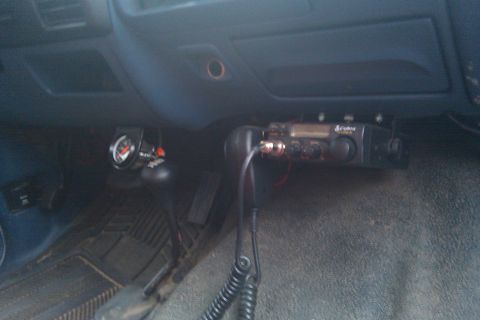 1996 Ford Bronco - Interior view of a vehicle with a CB radio and a gauge installed.