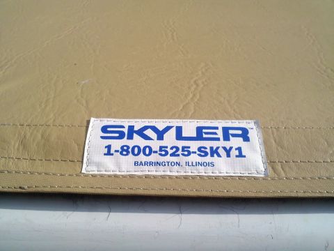 1996 Ford Bronco - A close-up of a tan car cover displays a label with contact information and location.