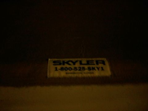 1996 Ford Bronco - Sticker with company name and phone number is visible on a dark surface.