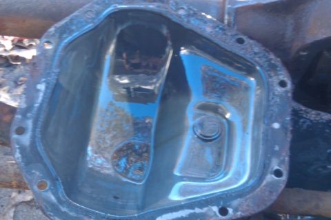1996 Ford Bronco - Close-up of a differential cover, showing internal components and a watermark.