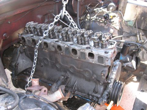 1981 Ford Bronco - Engine block and valve train are visible as the engine is being removed from the vehicle.