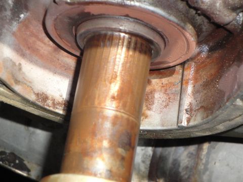 1995 Ford Taurus - A close-up view of a corroded metal shaft and its surrounding housing.