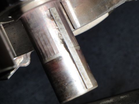 1995 Ford Taurus - A detailed view of a metal shaft a precisely machined keyway, essential for mechanical component alignment.