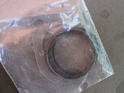 1995 Ford Taurus - New gasket and O-rings for automotive repair, packaged for protection.