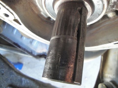 1995 Ford Taurus - A close-up view shows a damaged metal shaft with visible splines and a significant crack.