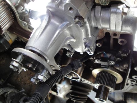 1995 Ford Taurus - A detailed view of an engine part, showing mechanical components and wiring.