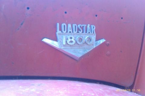 2000 Mercury Grand Marquis - A close-up shows the 'Loadstar 1800' emblem on a vehicle's exterior.