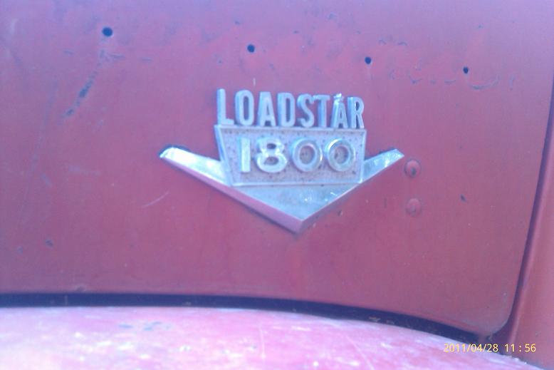 Close-up of a red vehicle's 'Loadstar 1800' badge