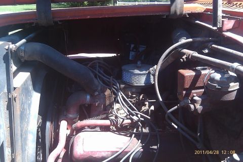 2000 Mercury Grand Marquis - Close-up view of an old truck's engine compartment with various hoses and components visible.