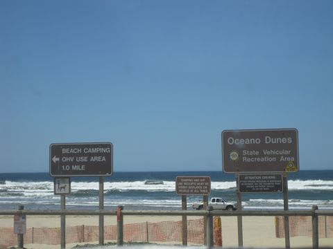 1989 Ford Bronco - A white pickup truck is visible on the beach at Oceano Dunes State Vehicular Recreation Area.