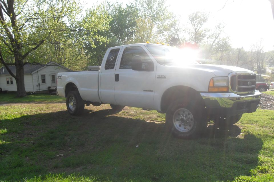 White crew cab pickup truck, 3/4 front view