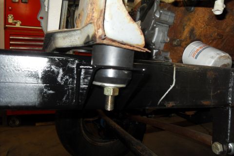1997 Ford Ranger - A close-up view of a vehicle's frame and a suspension component, with an oil filter in the background.