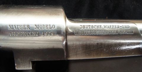 1991 Ford Bronco - Close-up of markings on a Mauser Modelo Argentino 1909 rifle receiver.