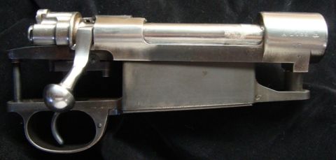 1991 Ford Bronco - The internal mechanism of a rifle, including the bolt, receiver, and trigger group, is displayed against a dark background.