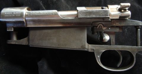 1991 Ford Bronco - Close-up of a rifle receiver showing manufacturer markings and model details.