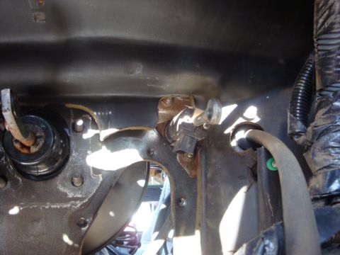 1989 Ford Bronco - Close-up view of the clutch pedal assembly, including the master cylinder and connection to the brake booster.
