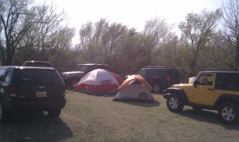 2005 Jeep Wrangler - Multiple Jeeps and tents are set up at an outdoor campsite.