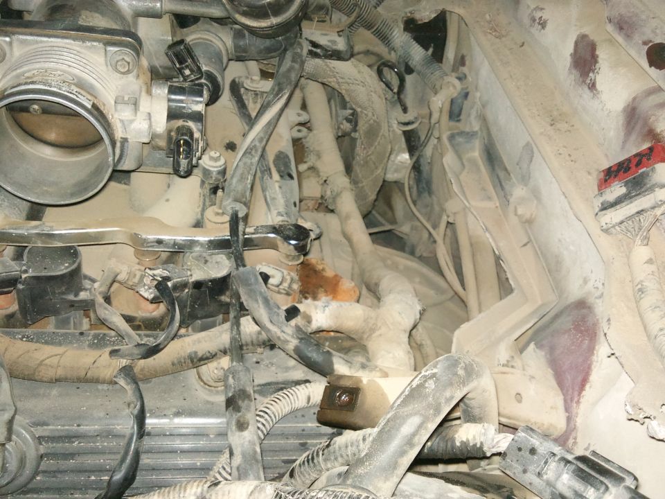 Engine bay with throttle body and wiring
