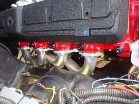 1989 Ford Bronco - Close-up view of an engine's exhaust manifold and intake ports.