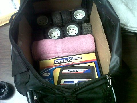 2011 Ford 427 - RC car parts and charger packed in a bag.
