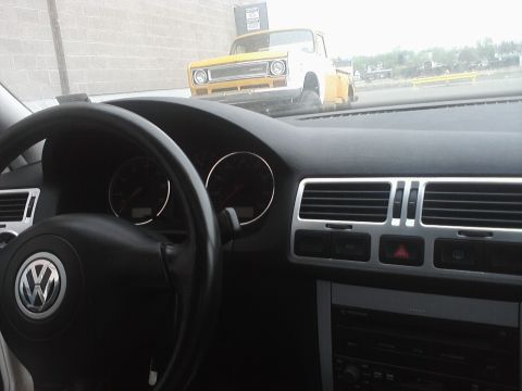 2001 Volkswagen Jetta - A yellow pickup truck is visible in the distance, viewed from inside a Volkswagen.