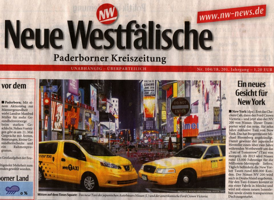 Two yellow NYC taxis, one Nissan NV200 and one Ford Crown Victoria, parked on a city street at night