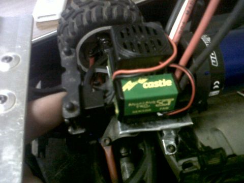 2011 Ford 427 - Close-up of an electronic speed controller for an RC car, labeled 'Castle Creations SCT'.