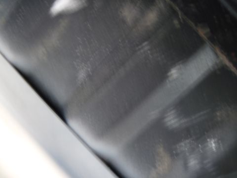 1979 Ford Bronco - Close-up view of the underside of a vehicle, showing wear and tear, with a Supermotors watermark in the corner.