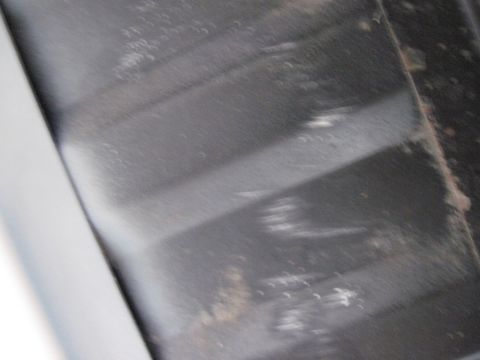 1979 Ford Bronco - Close-up of a textured metal surface, possibly from a vehicle part.