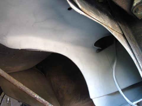 1979 Ford Bronco - A close-up shot reveals the underside of a vehicle, focusing on the wheel well area.