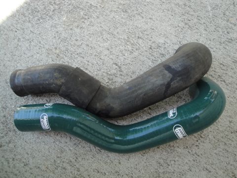 1995 Ford Taurus - Comparison of an old rubber radiator hose and a new green Samco Sport silicone hose.