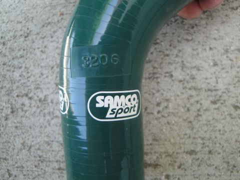 1995 Ford Taurus - A green silicone hose with "SAMCO SPORT" branding and a "3206" imprint is shown.