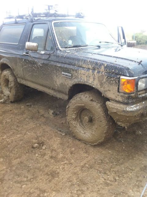1990 Ford Bronco - This 1990 Ford Bronco is covered in mud, suggesting it has been driven off-road.