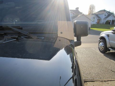 2008 Jeep Wrangler - Custom bracket installed on a Jeep Wrangler's hood near the windshield.